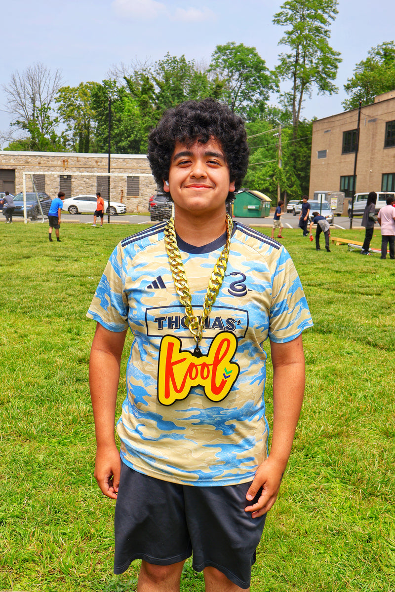 kid smiling with kool chain
