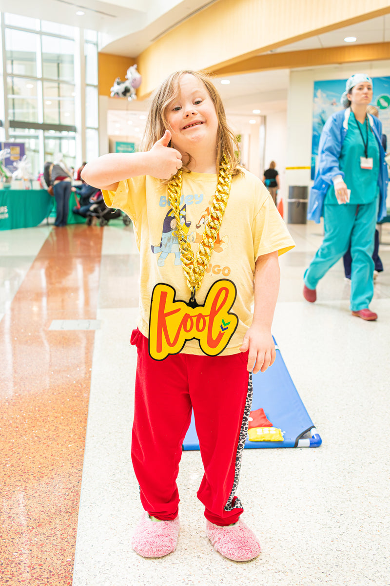 child at nemours hospital gives a thumbs up