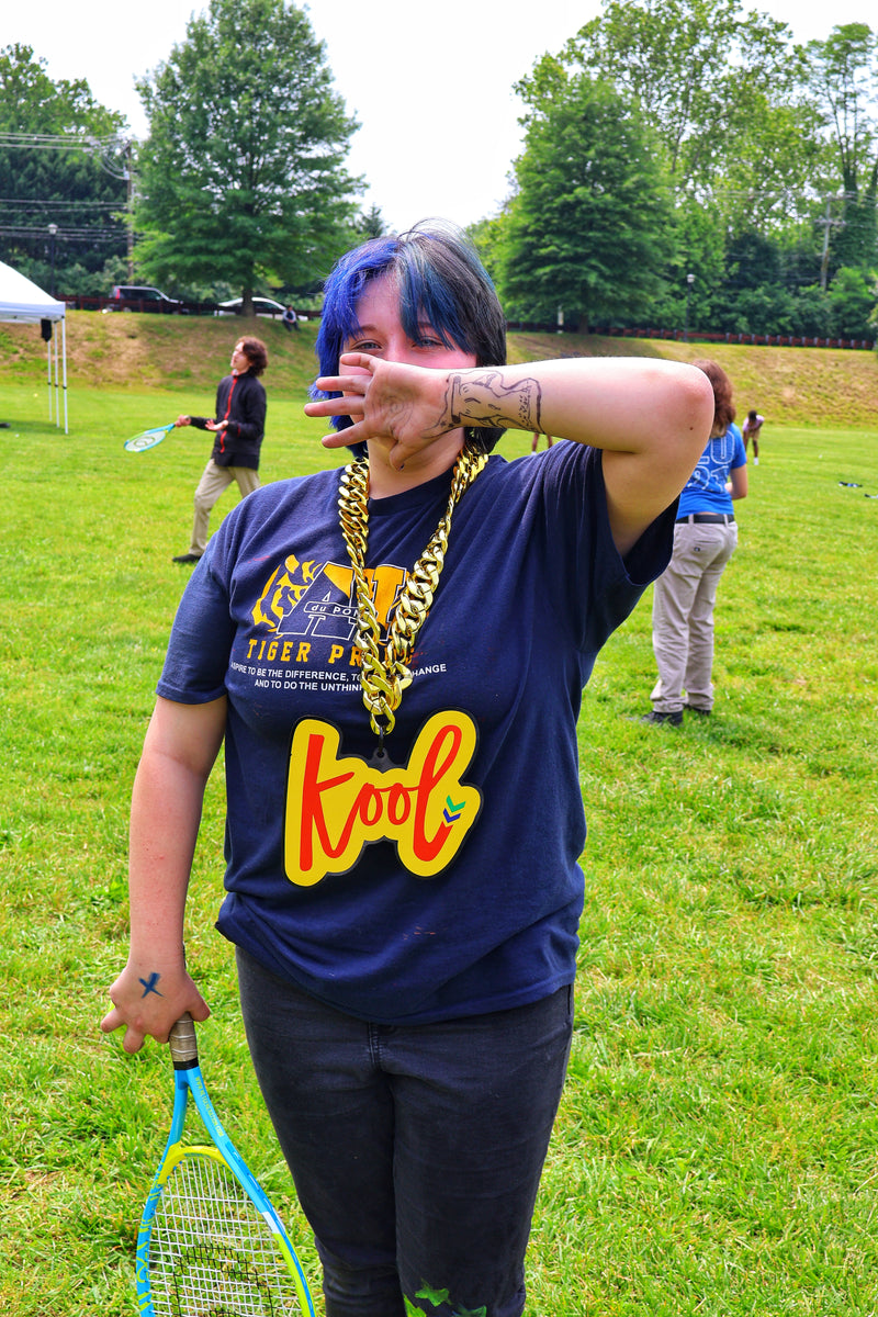 girl covers mouth wearing kool chain