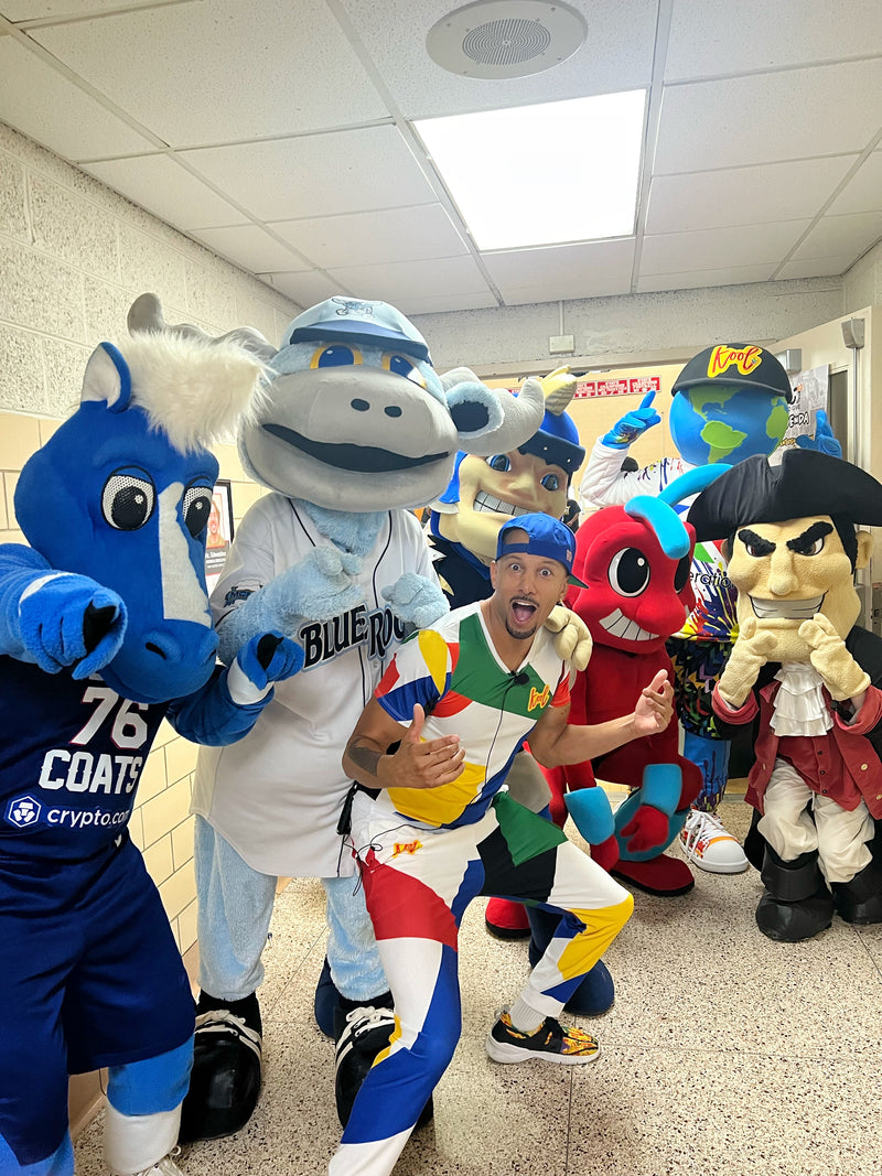 koolis creator takes a picture with all mascot that showed to welcome kooli to the world at 100 pairs to give x3
