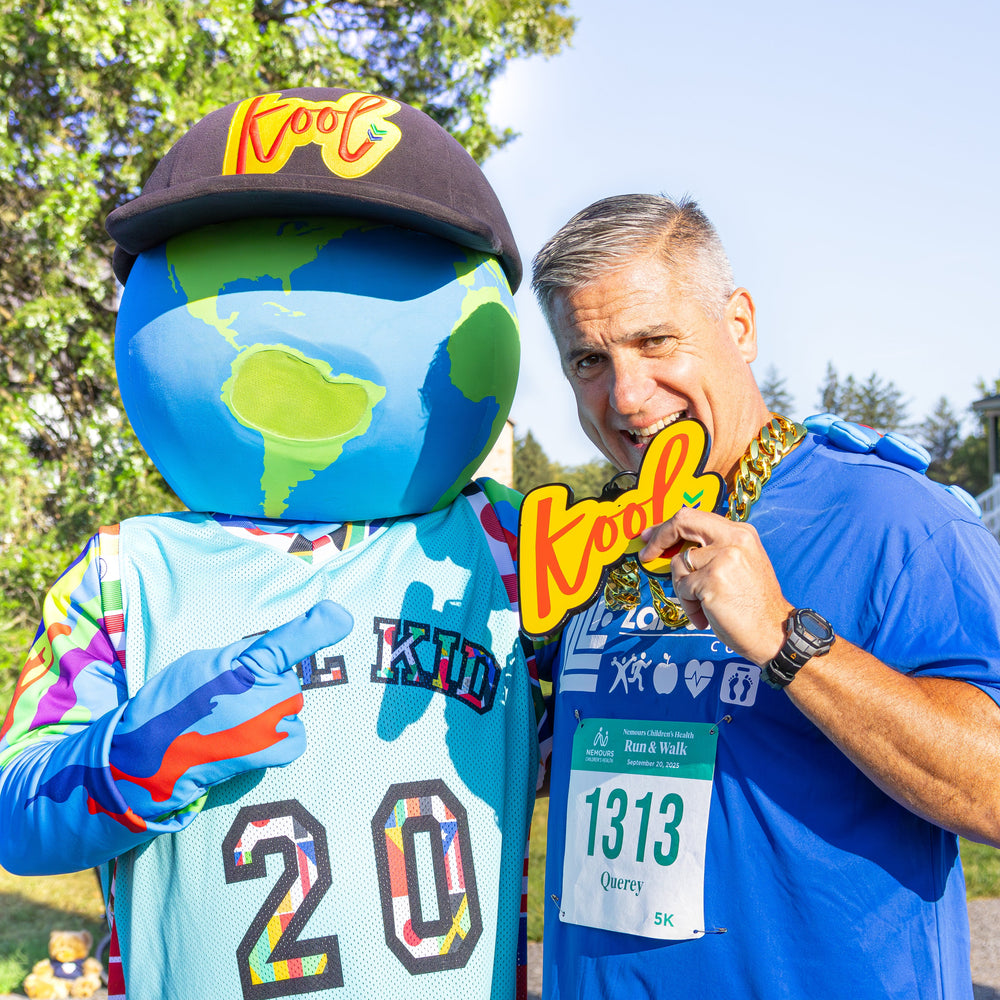 kooli takes pic with nemours walk run attendee