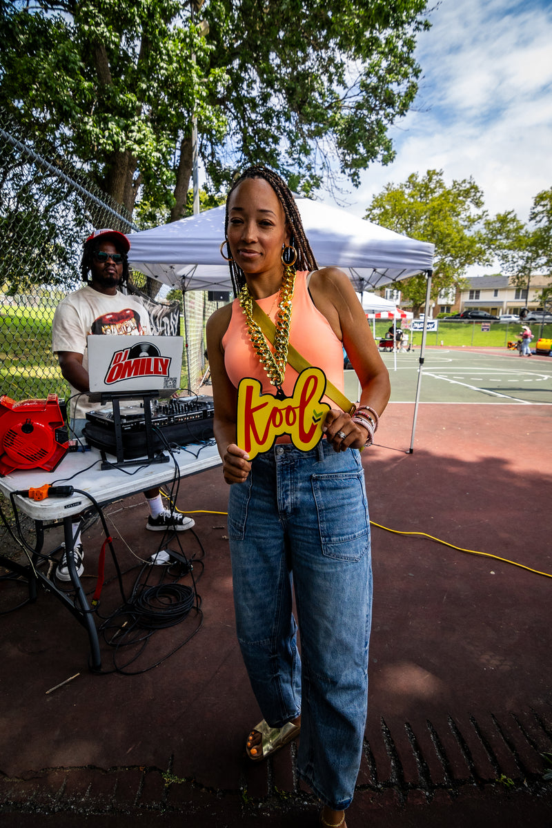 kool lady wears  kool chain by dj booth