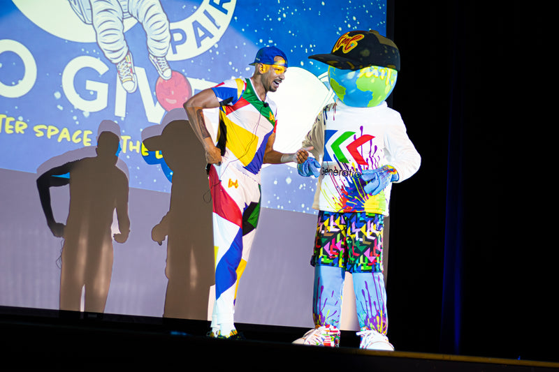 kooli and creator on stage at 100 pairs to give x3