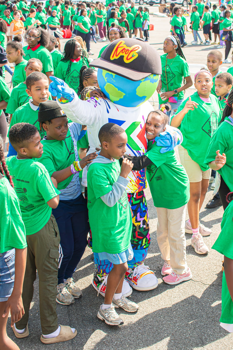 kooli surrounded around a group of kids