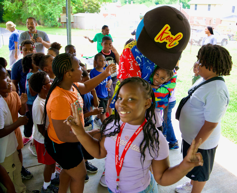 kooli hugs camp attendee during wilmington delaware parks & rec tour 2