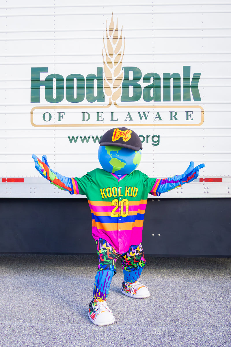 kooli standing in front of food bank of delaware truck at massive food pantry