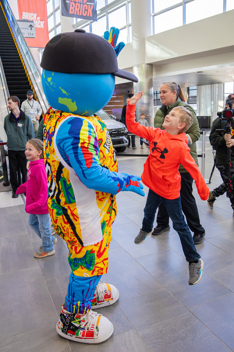kooli takes the time to hi five kid before the harlem globetrotters game in philadelphia