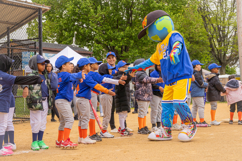 kooli high fives teams during game opener