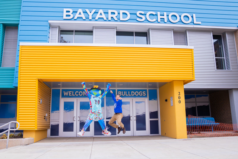 kooli jumps for joy in front of bayard school in wilmington delaware
