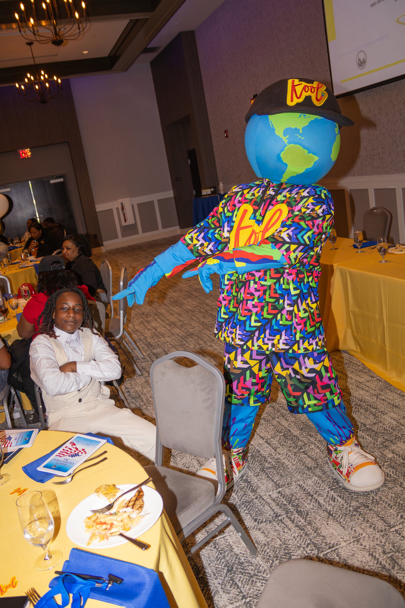 kooli pointing at mayor for the day at a formal event.
