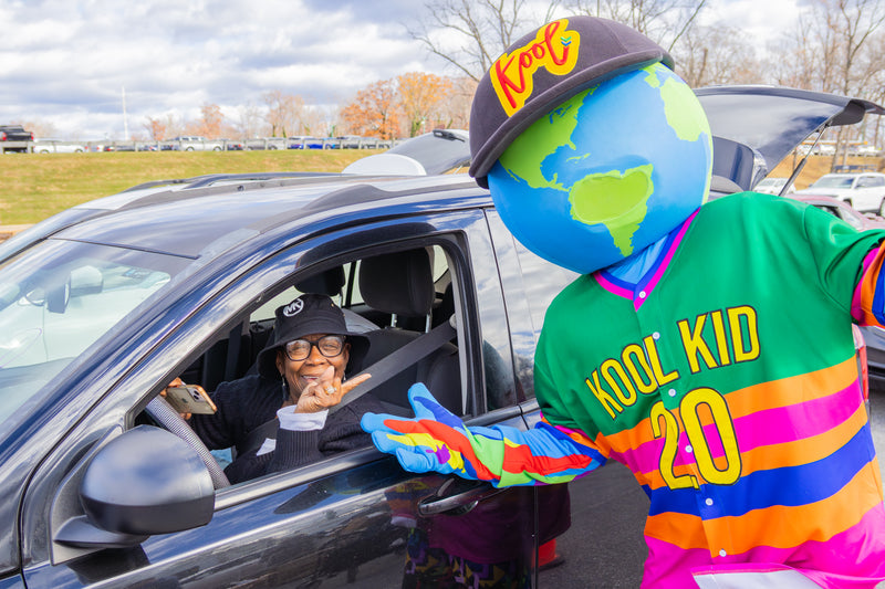 kooli posing with guest as they wait at the food bank of delaware pantry