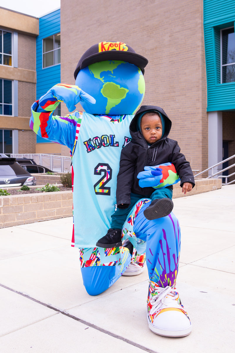 kooli posing with child