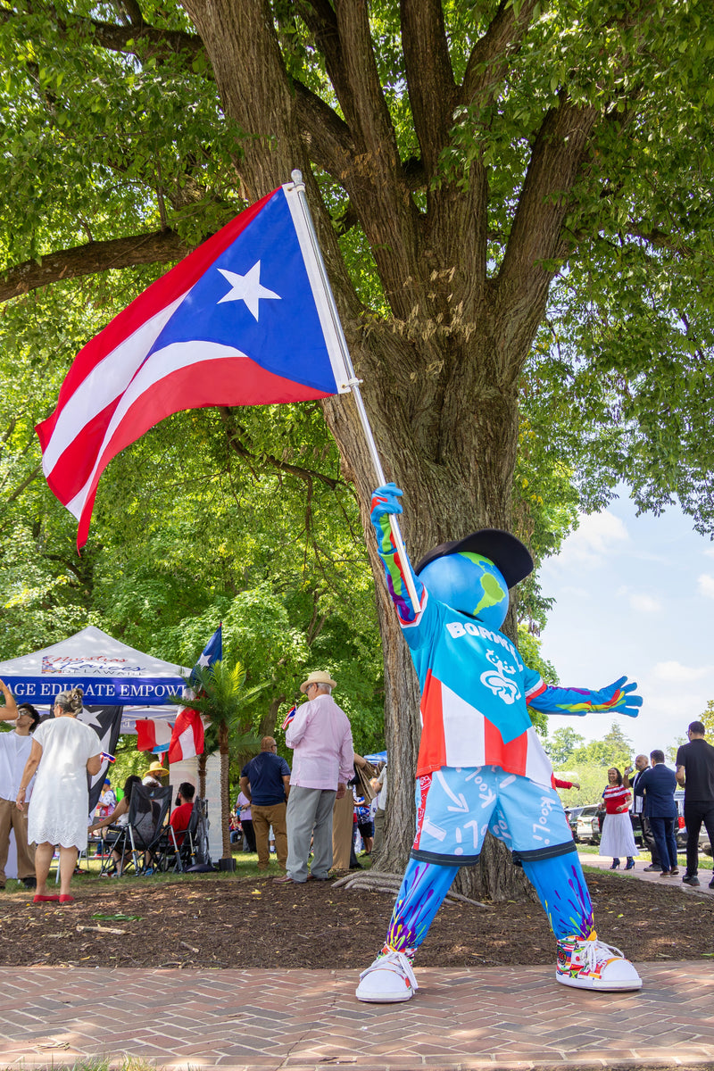 kooli holding pr flag at pr day in dover delaware