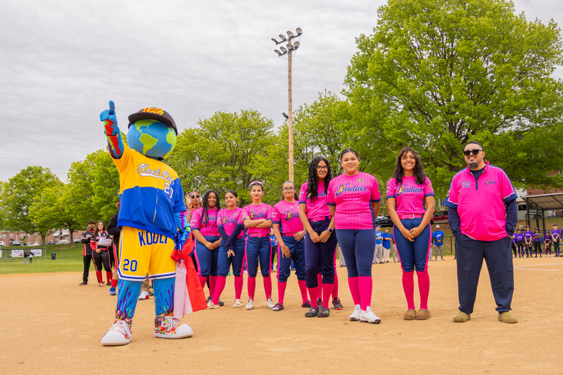 kooli stands with female RCBL team