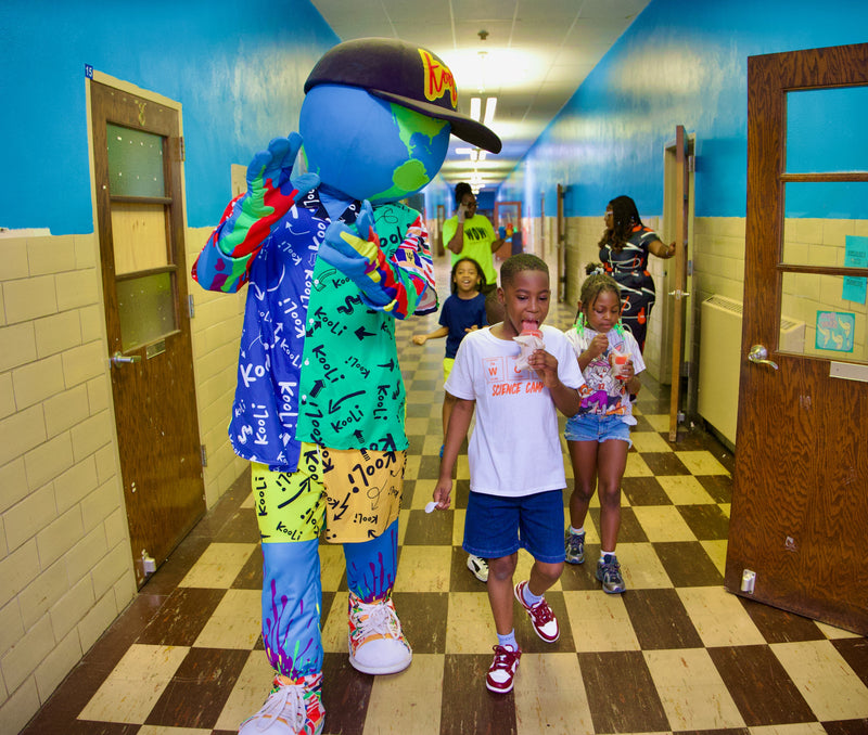kooli walking the halls at summer camp stop with kids eating with kooli