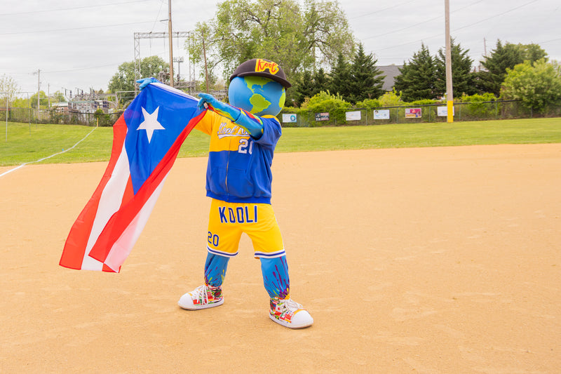 kooli waves PR flag during RCBL game opener