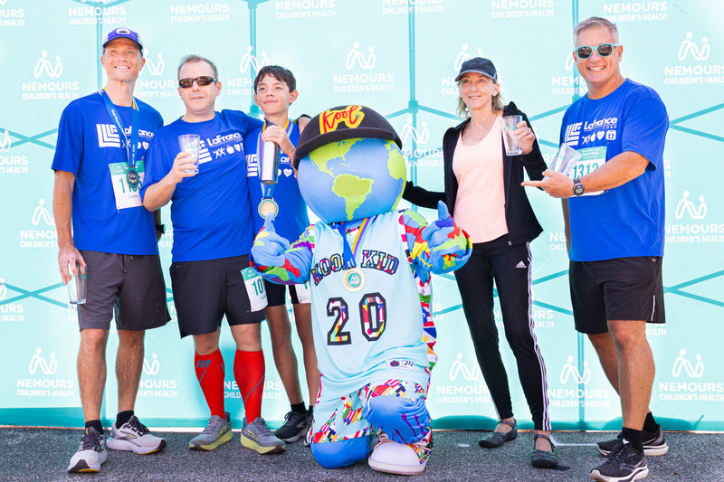 kooli smiling with winners at the nemours 5k walk run in wilmington delaware