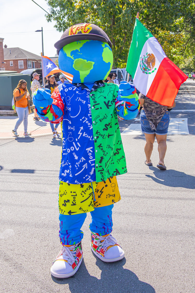 kooli waves flags at hispanic day parade in wilmington delaware