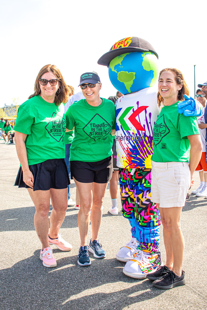 kooli poses with a group of ladies