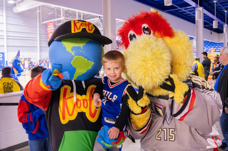 kooli snaps a photo with wingston philadelphia wings mascot and child