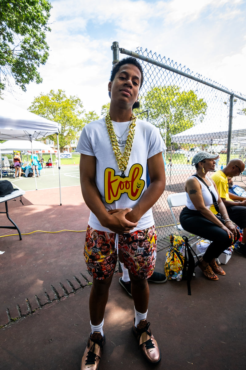 kid on sidelines wears kool chain