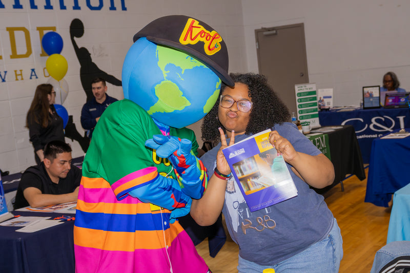 kooli having fun and interacting with attendee at college fair event
