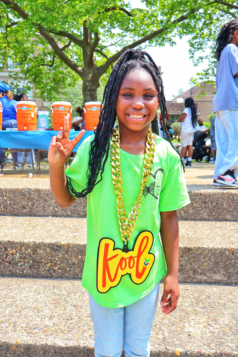 girl smiling with kool chain