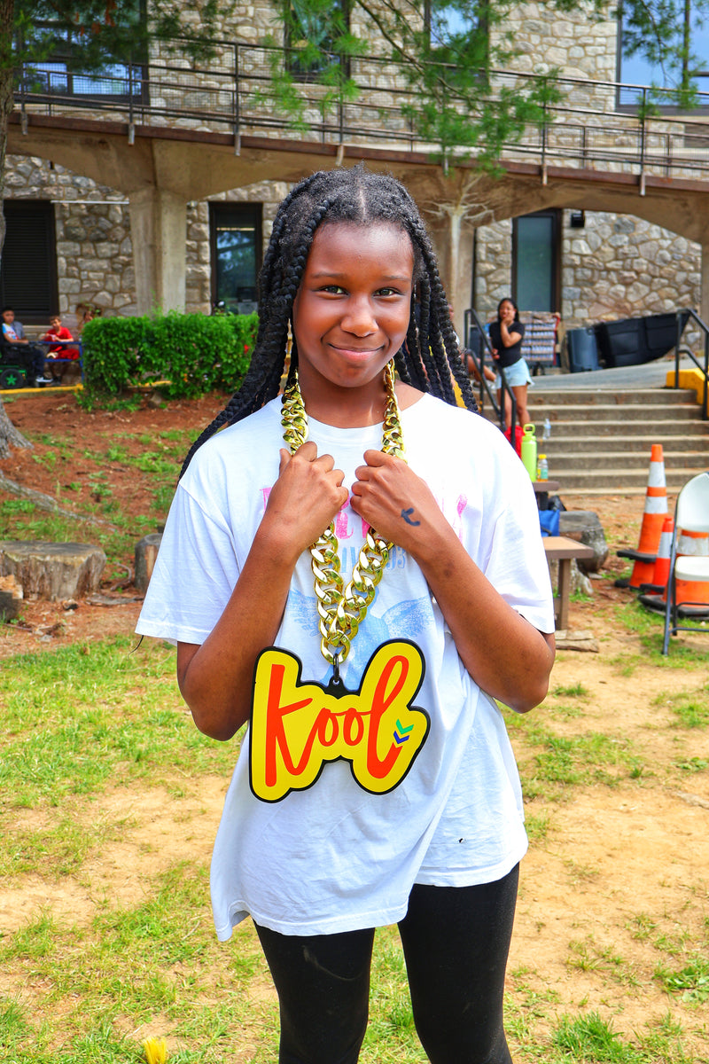 girl holds kool chain