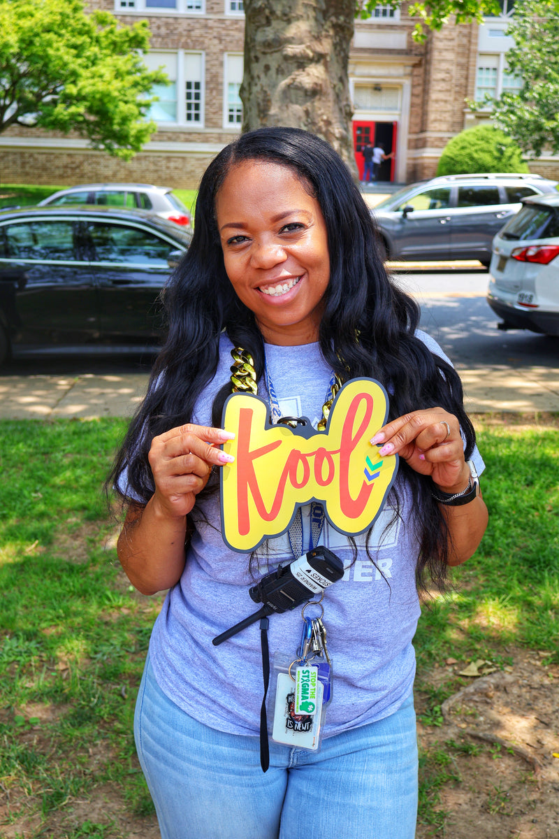 kool teacher wearing kool chain