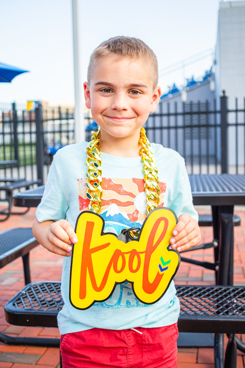young boy wearing the kool chain